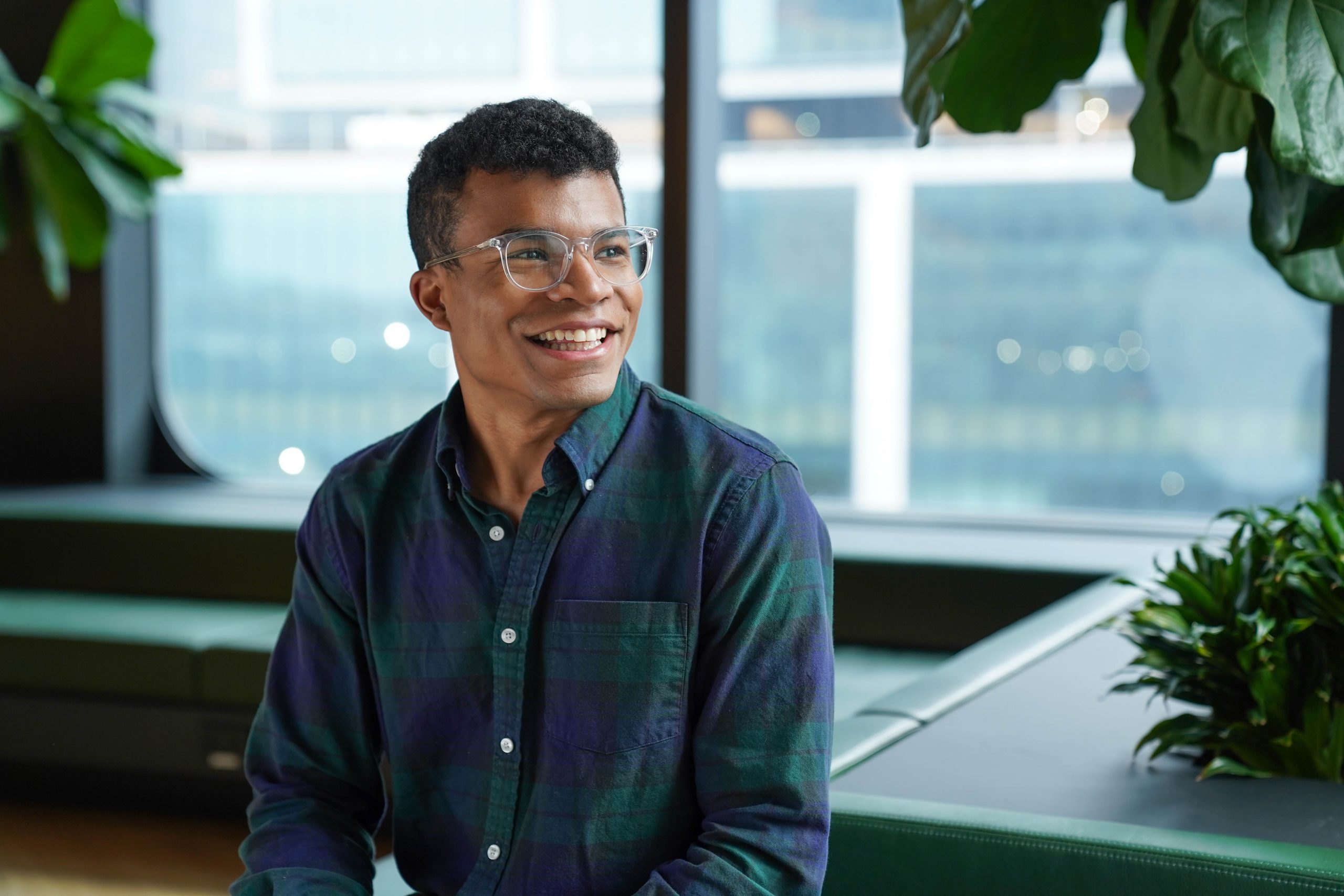 Male employee smiling in office